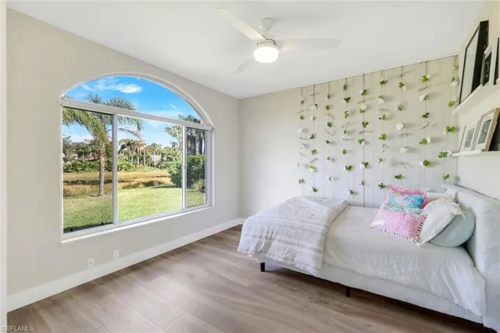 Bedroom featuring hardwood / wood-style floors and ceiling fan