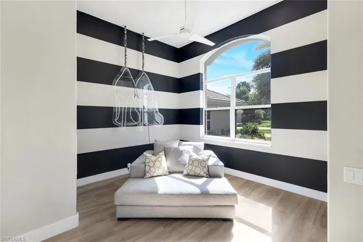 Living area featuring hardwood / wood-style floors and ceiling fan