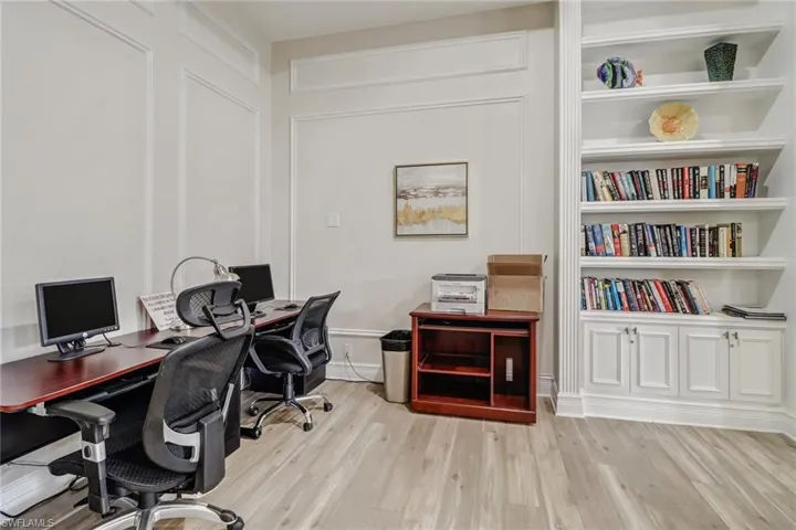 Home office with light wood-type flooring