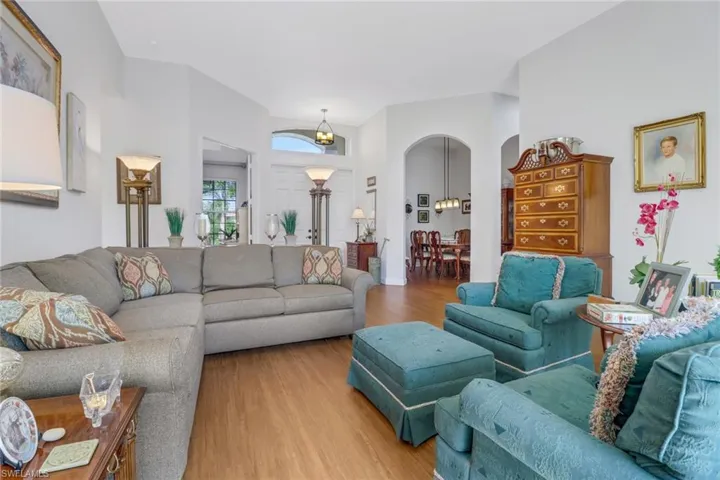 Living room featuring hardwood / wood-style flooring and a chandelier