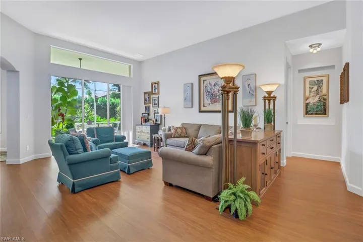 Living room with wood-type flooring