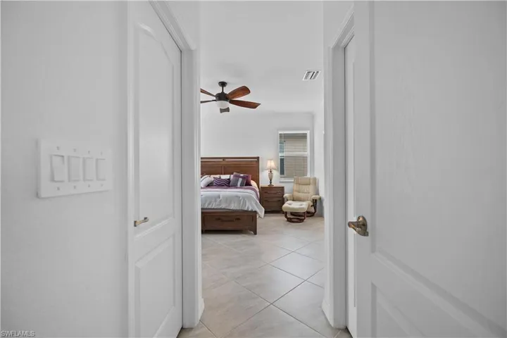 Primary Suite entrance with walk-in closets on each side