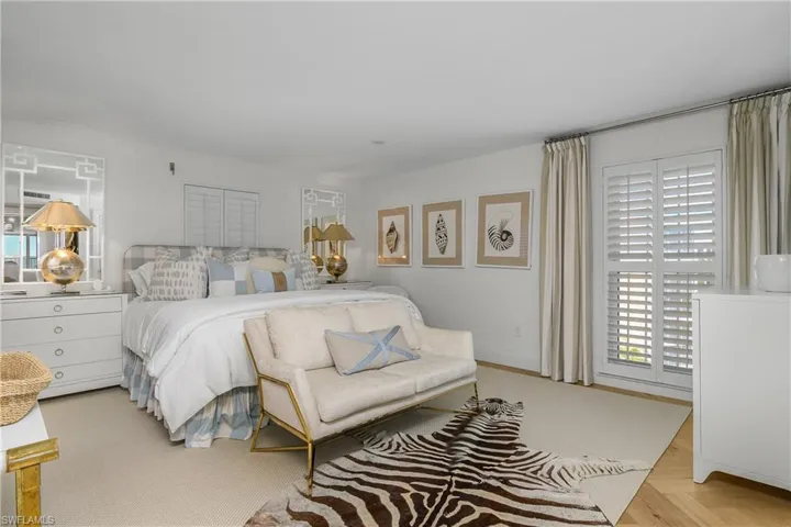 The primary bedroom is spacious, with two closets, and adjacent pocket office