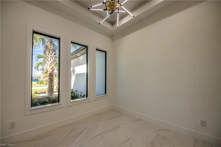 Spare room with a chandelier
