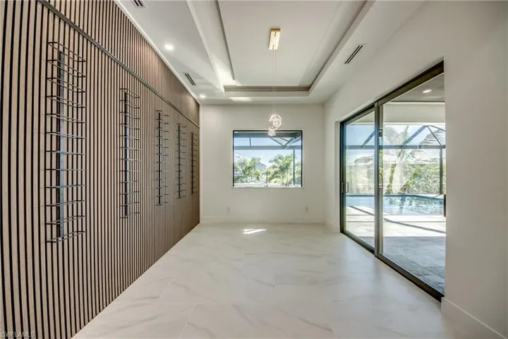 Hallway with a raised ceiling