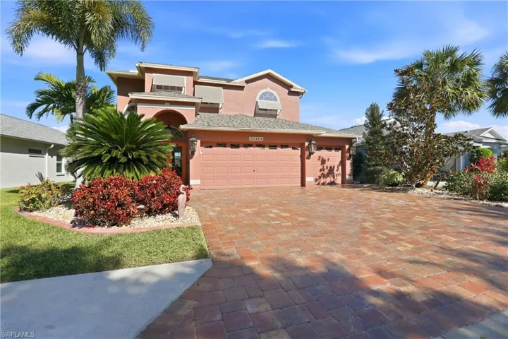 Mediterranean / spanish-style home with stucco siding and decorative driveway