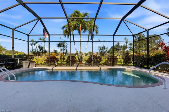 Outdoor pool featuring a sunroom, a lanai, and a patio area