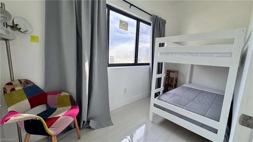 Bedroom featuring baseboards