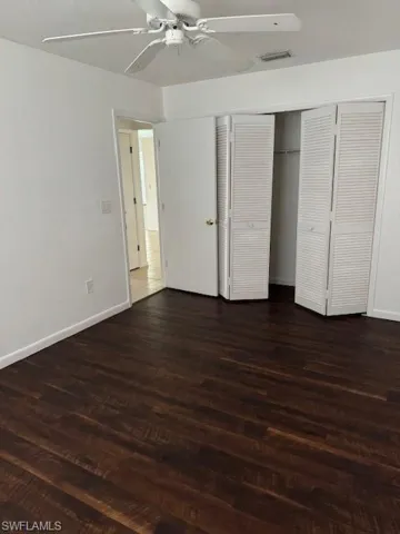 1st bedroom with dark floors