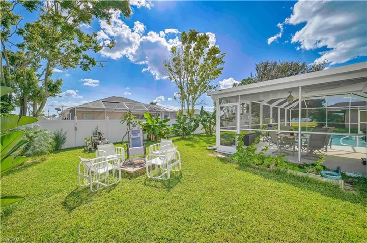 View of yard featuring a fenced in pool and a patio area
