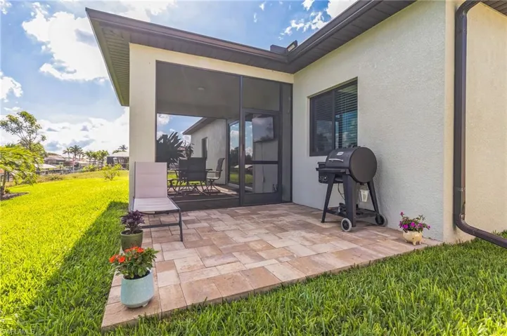 View of patio / terrace with a grill and outdoor dining area