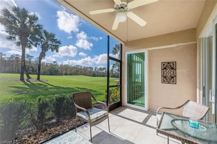 Sunroom featuring ceiling fan