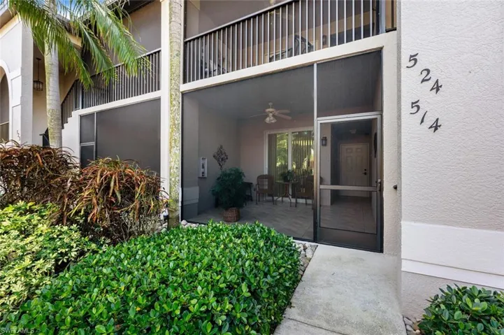Doorway to property featuring ceiling fan