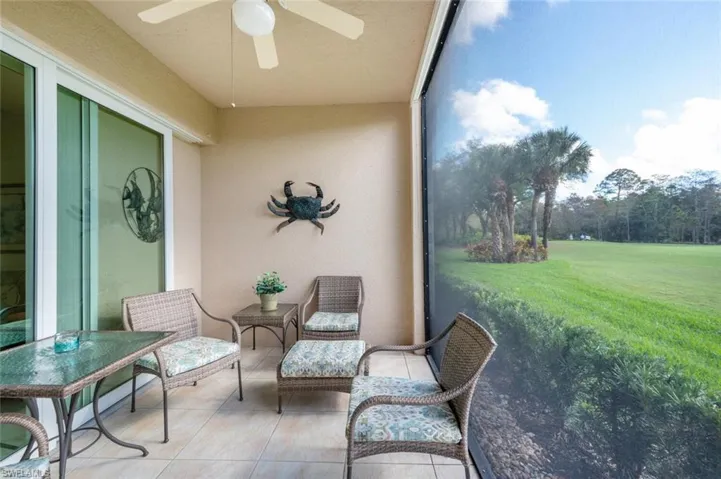 Sunroom / solarium featuring ceiling fan