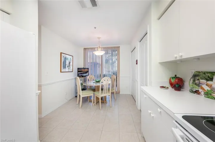 Dining space featuring light tile patterned floors