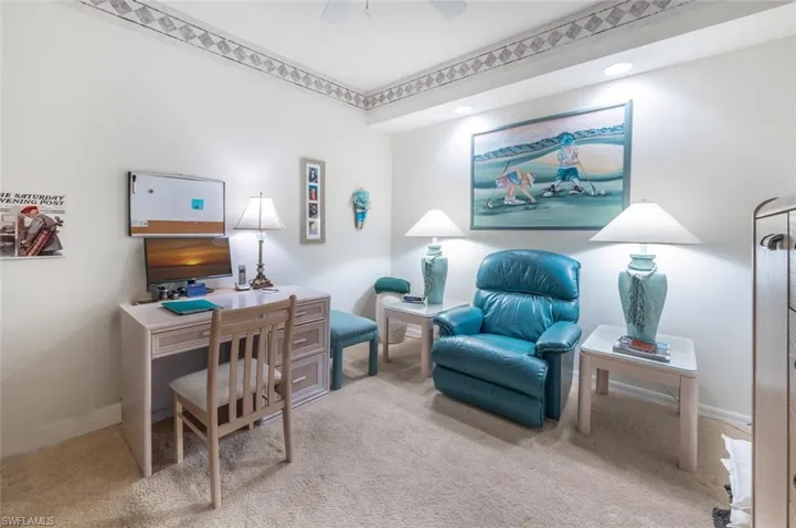 Office featuring light colored carpet and ceiling fan