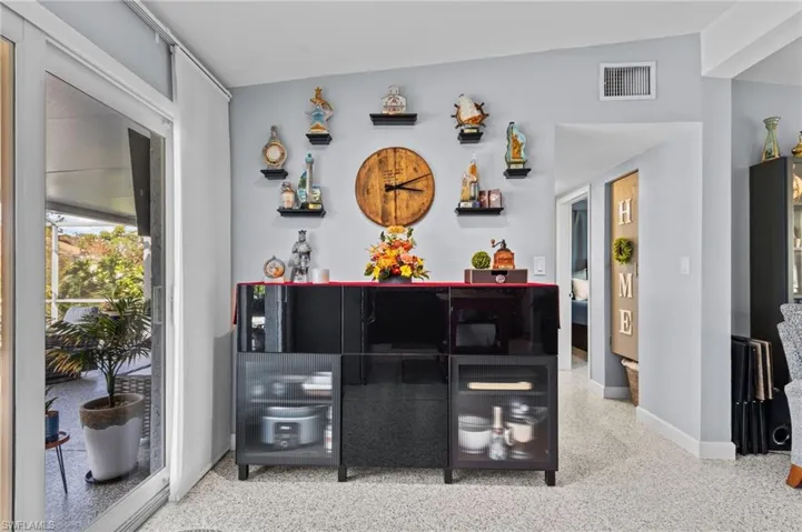 Bar featuring vaulted ceiling