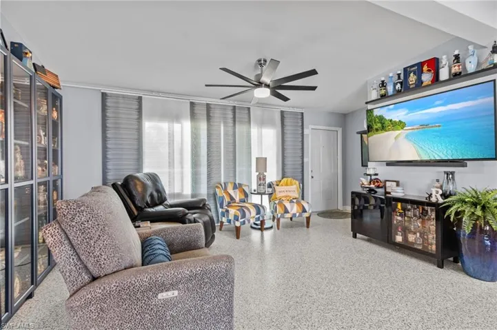 Living room featuring ceiling fan