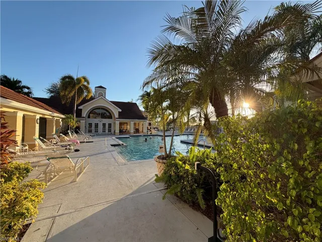 Community pool featuring a patio area and french doors