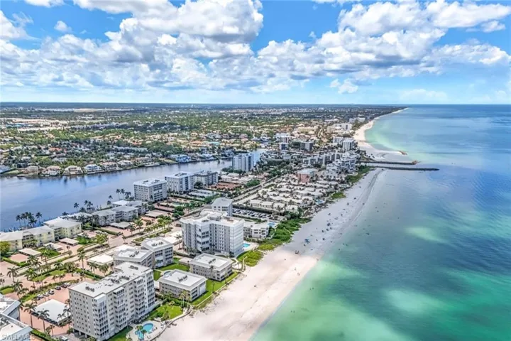 Bird's eye view featuring a water view and a view of the beach