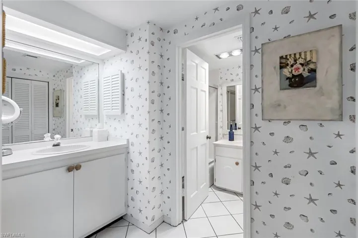 Bathroom with vanity and tile patterned flooring