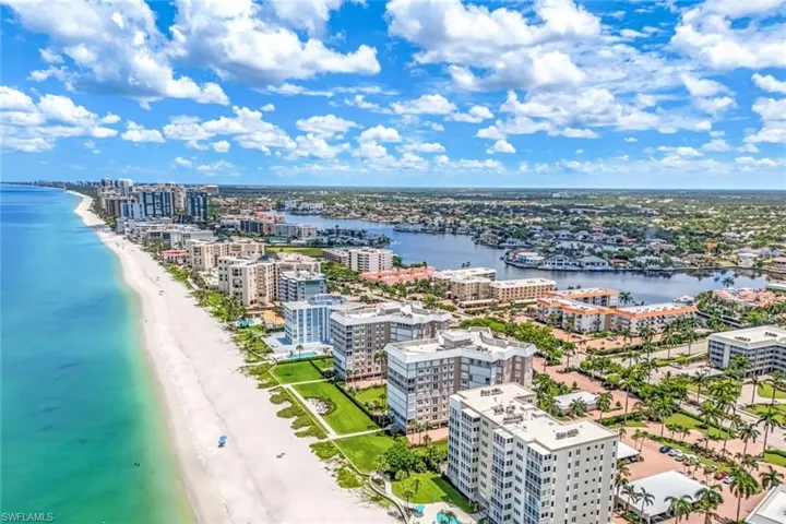Bird's eye view with a view of the beach and a water view