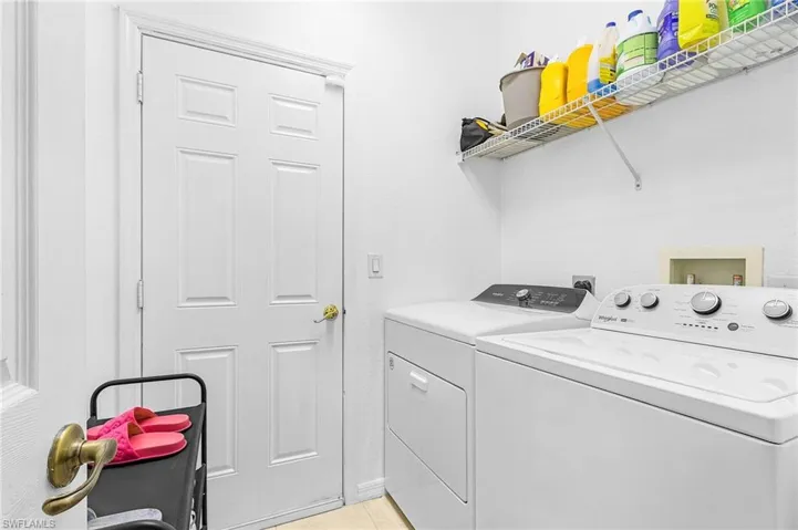 Clothes washing area featuring independent washer and dryer