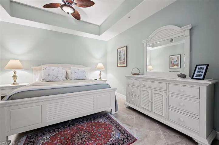 Bedroom with visible vents, baseboards, and ceiling fan