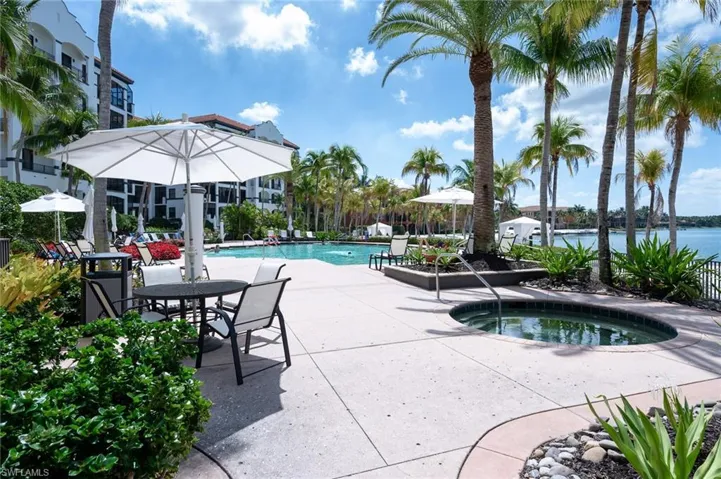 Pool with a patio area and a community hot tub