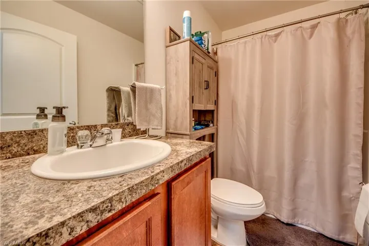 Bathroom with toilet and vanity