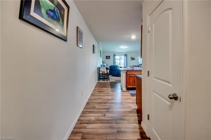 Hallway featuring wood-type flooring