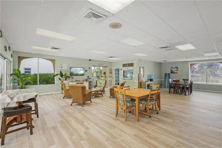 Dining area with a drop ceiling and light wood-style floors