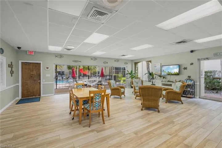 Dining space featuring a drop ceiling and light wood finished floors