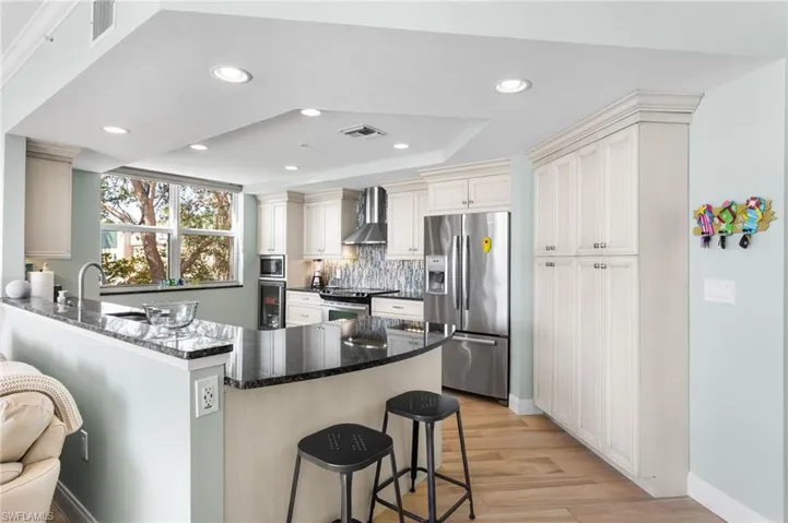 Large pantry, recessed lighting, breakfast bar.