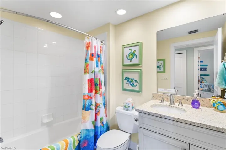 Guest bathroom with new vanity, combination tub/shower.