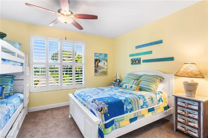Large guest room with full size bed + twin bunk beds and Plantation shutters!