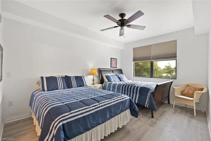 Bedroom featuring light wood-style flooring and a ceiling fan