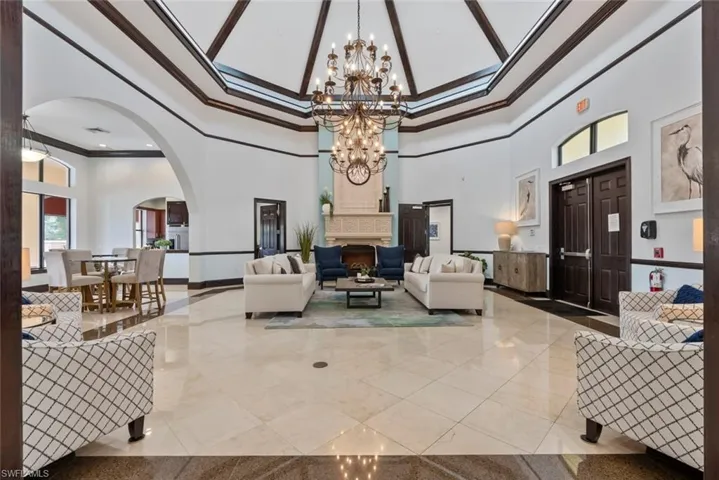 Community lobby featuring a high ceiling and ornamental molding