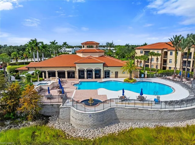 Community pool featuring a patio area