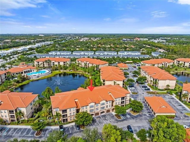 Bird's eye view of apartment complex / building and a nearby body of water