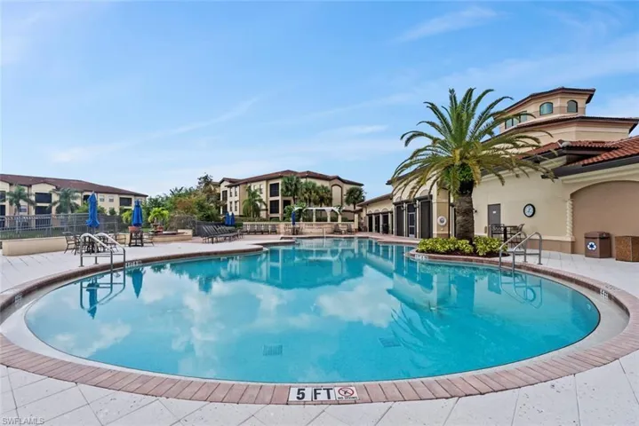 Community pool with a patio area