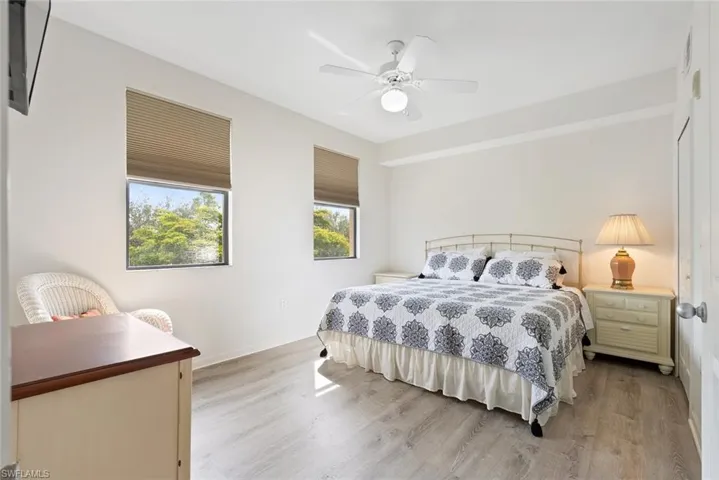 Bedroom with wood finished floors and ceiling fan