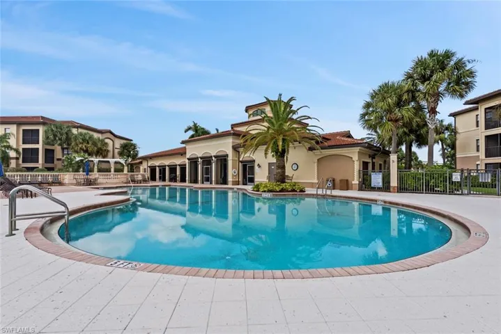 Community pool featuring a patio
