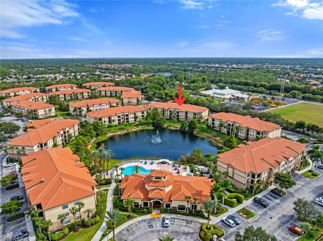 Aerial view of apartment complex and a large body of water