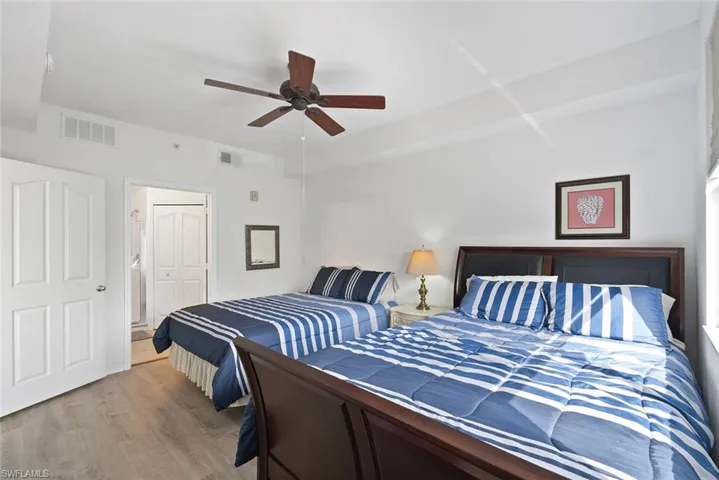Bedroom with wood finished floors and ceiling fan