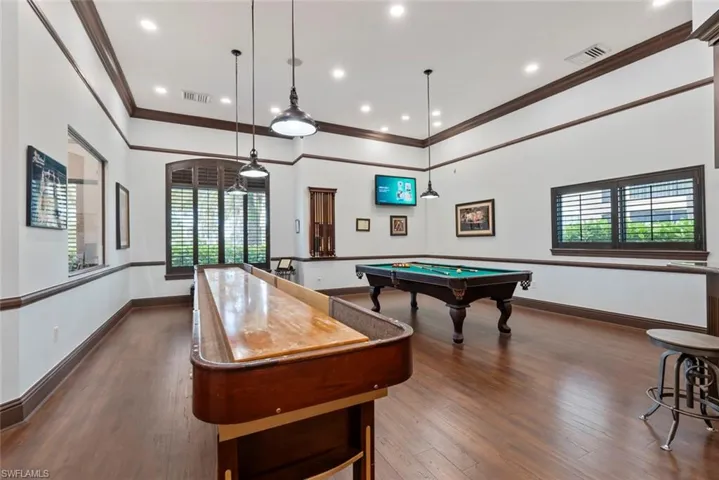Recreation room with dark wood finished floors, crown molding, recessed lighting, and billiards