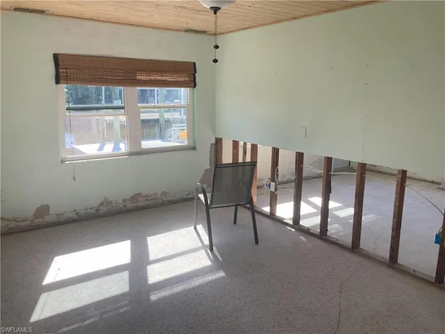 Unfurnished room featuring wood ceiling