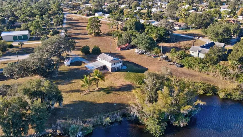 View of acerage and rustic home.