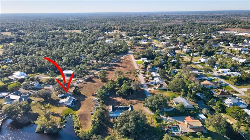 Aerial view of property and surrounding area.