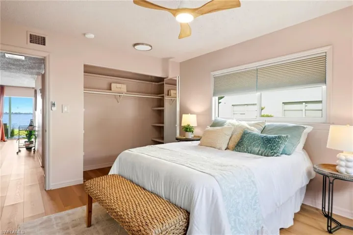 Bedroom with closet and ceiling fan
